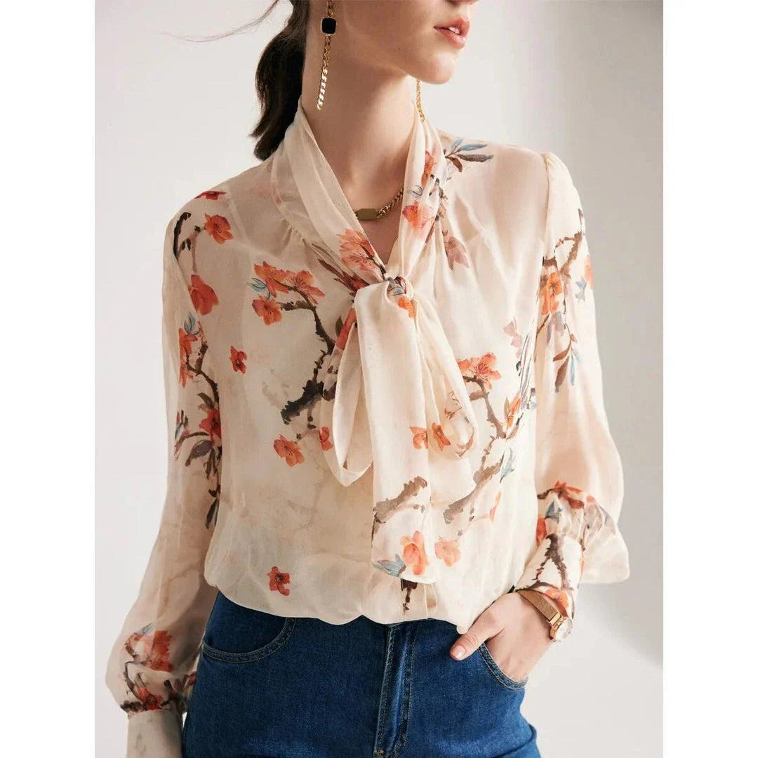 Elegant floral pattern silk and viscose blend blouse with bow collar and puff sleeves