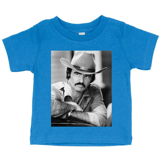 A vintage-inspired baby t-shirt featuring the iconic Burt Reynolds design, made with soft and breathable Airlume cotton.