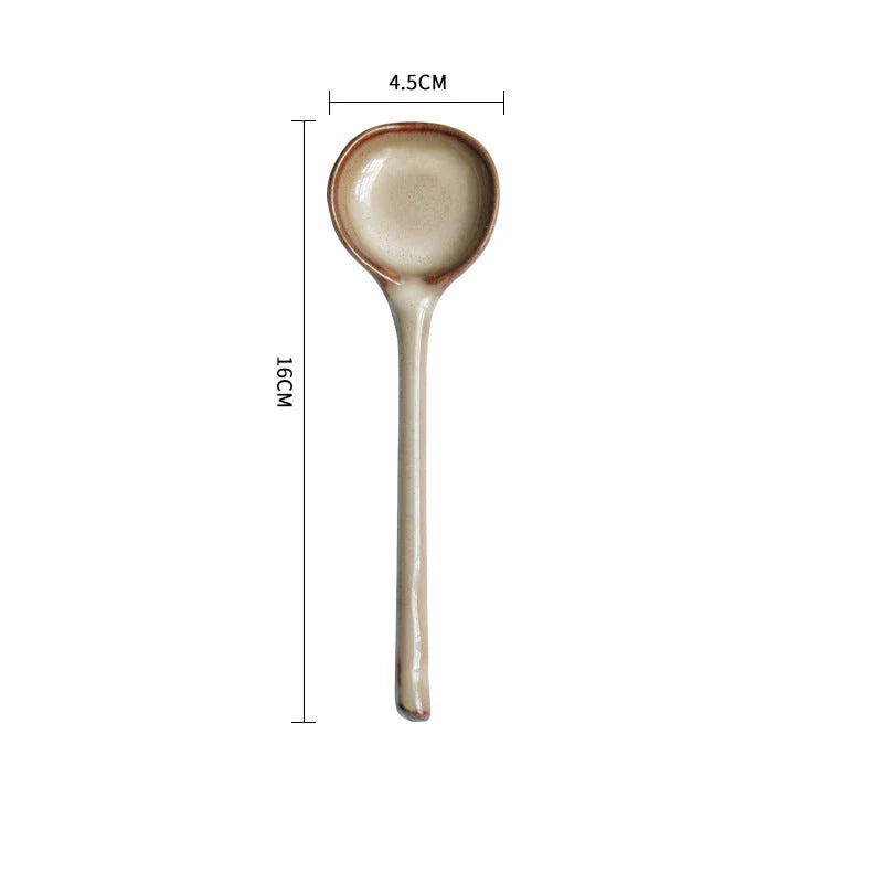 Elegant British ceramic soup spoon with long handle and vibrant glaze for refined dining experience