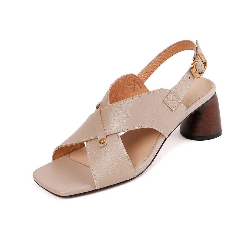 Elegant leather high heel sandals in khaki colour for women, featuring a 5.5 cm square heel, secure buckle strap, and sleek design.