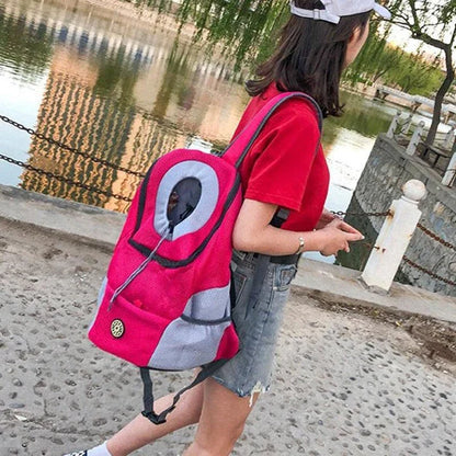 Compact dog carrier backpack made of durable nylon with a convenient front hole for small dogs to poke their head out