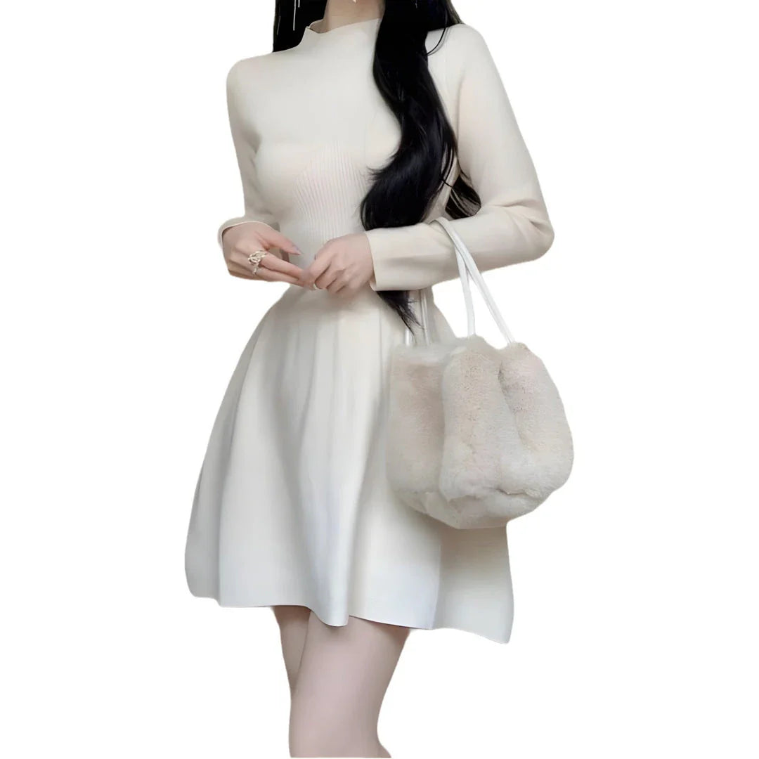 A high-waisted, knitted A-line skirt in a solid colour, perfect for autumn and winter wardrobes.
