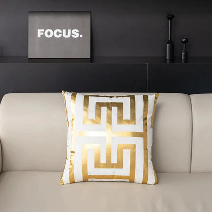Pair of Nordic-inspired geometric plush pillowcases with a luxurious gold pattern on a white and black background