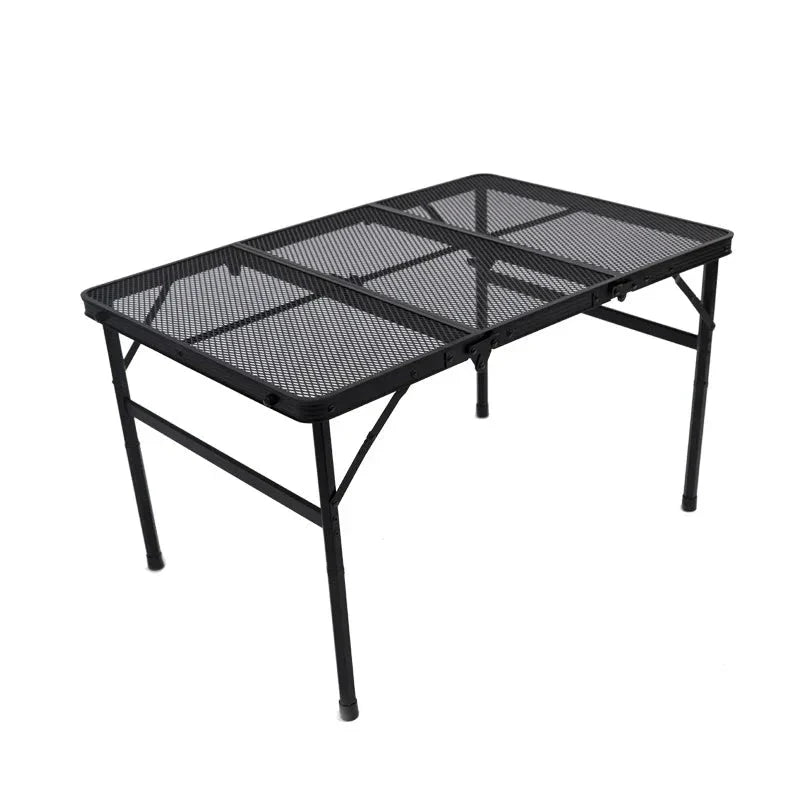 Adjustable portable folding camping table with aluminium frame, black in colour, set up outdoors
