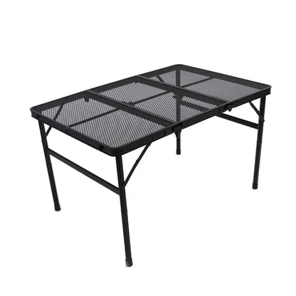 Adjustable portable folding camping table with aluminium frame, black in colour, set up outdoors