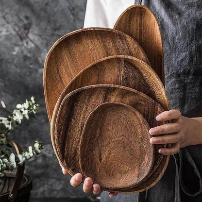 Elegant wooden dining plates with a minimalist, laconic design and natural wood grain