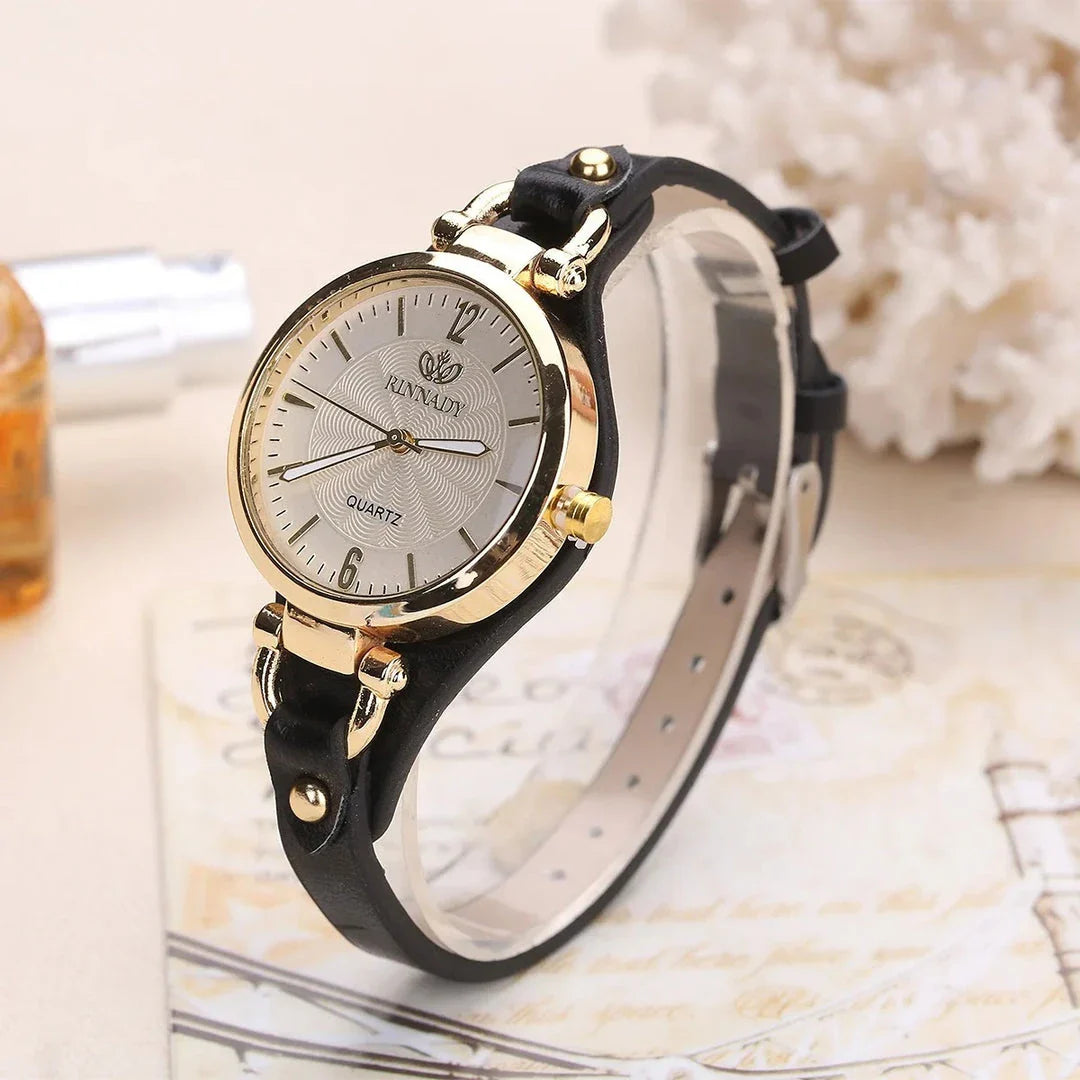 Elegant women's quartz watch with a black leather strap, featuring a sleek alloy case and a durable glass dial window