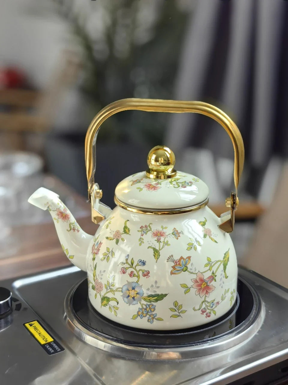 Elegant enamel outdoor kettle with a 1200 ml capacity, designed for brewing tea in style