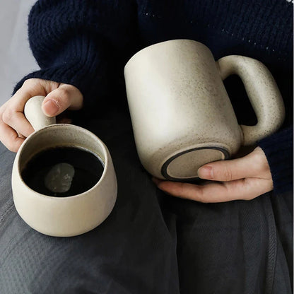 Elegant Japanese stoneware retro coffee mug in solid apricot and grey colours with comfortable handgrip shape