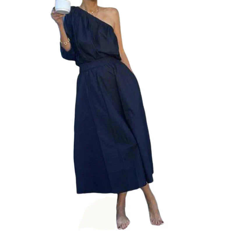 Elegant two-piece set with oblique shoulder blouse and midi skirt in black colour