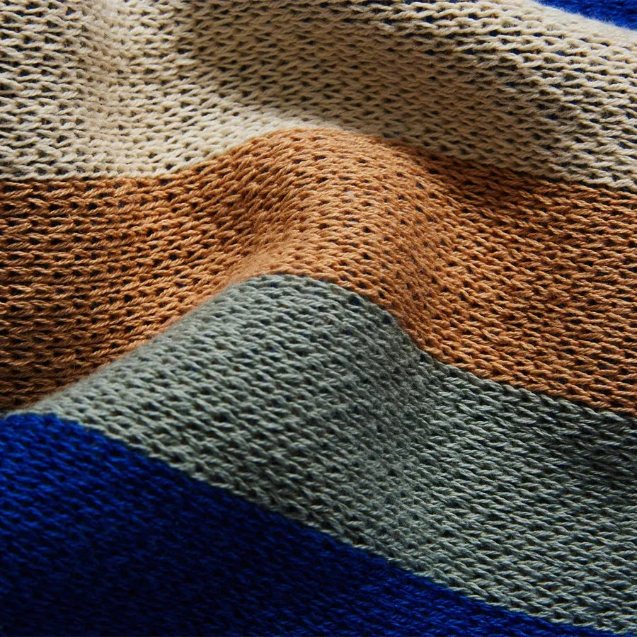 Cosy 100% cotton striped plaid throw blanket in vibrant orange and blue hues, perfect for adding rustic charm to any living space.