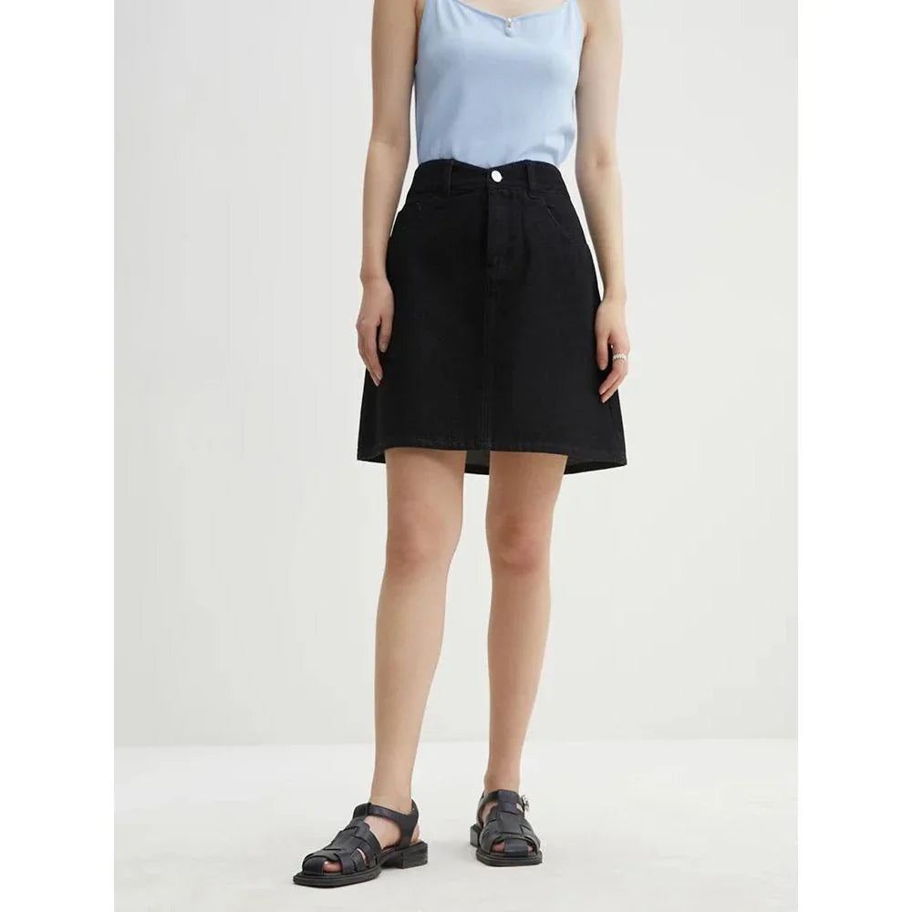 Chic high-waisted denim skirt in a classic blue shade, featuring an A-line silhouette and a flattering empire waistline.