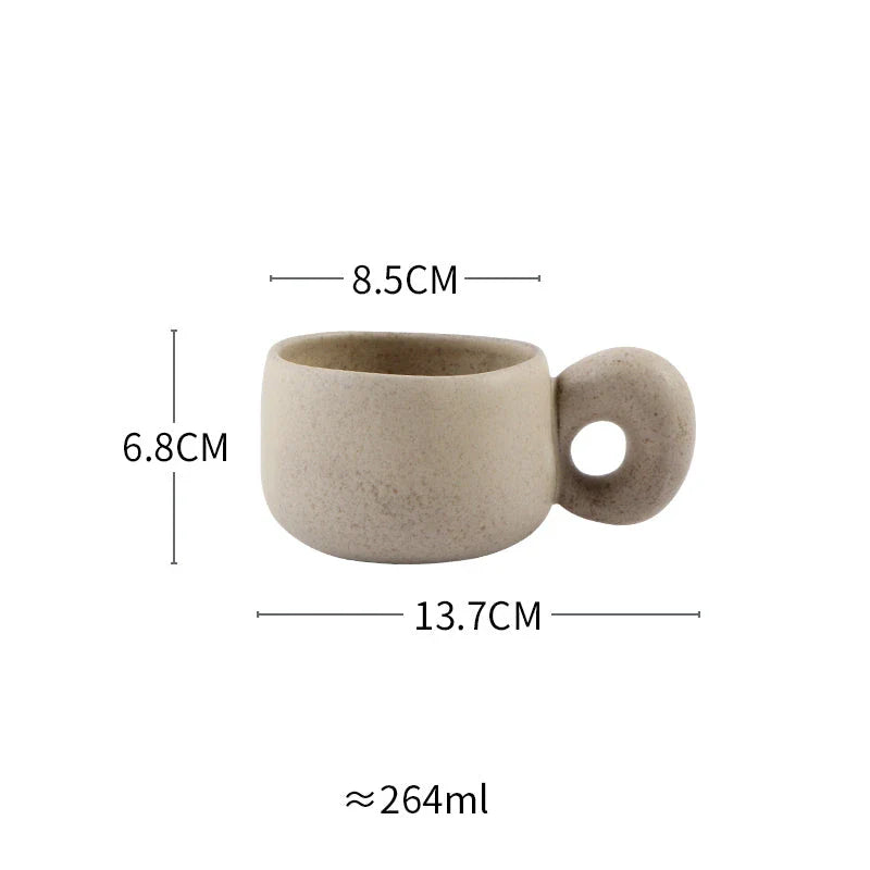 Elegant Japanese stoneware retro coffee mug in solid apricot and grey colours with comfortable handgrip shape