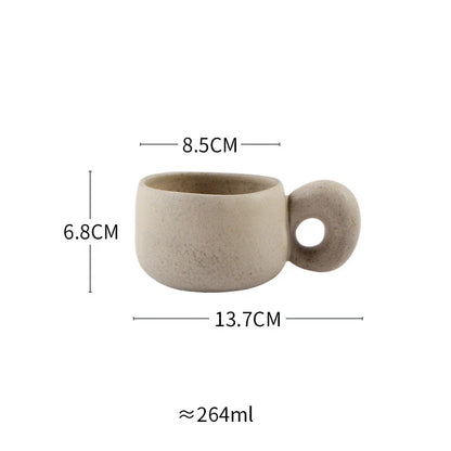 Elegant Japanese stoneware retro coffee mug in solid apricot and grey colours with comfortable handgrip shape