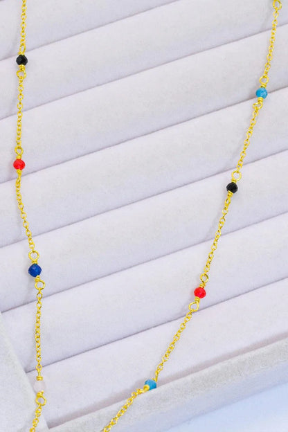 Elegant 18-carat gold-plated necklace with multicoloured beads in a minimalist, contemporary design