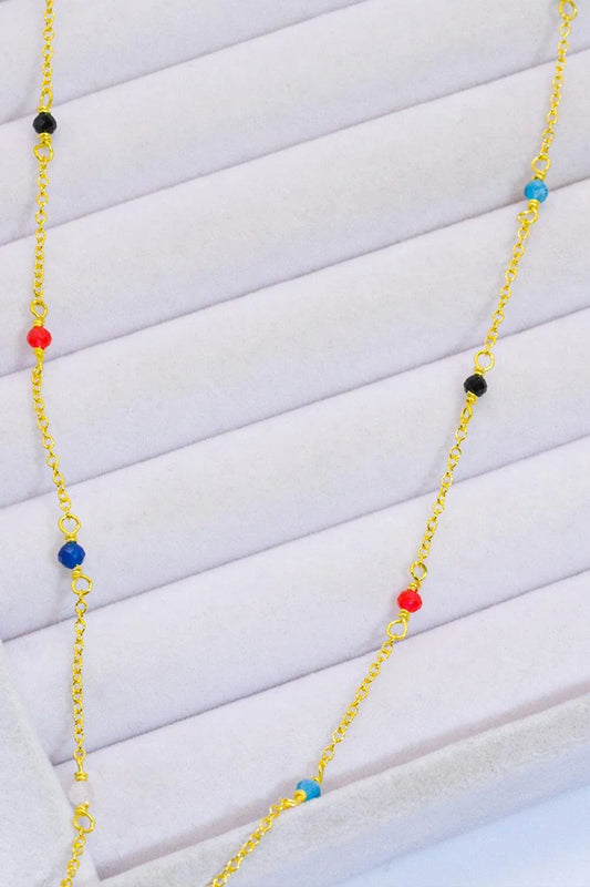 Elegant 18-carat gold-plated necklace with multicoloured beads in a minimalist, contemporary design