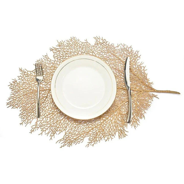 Elegant floral-patterned PVC dining table coaster in a contemporary setting, protecting a wooden table surface