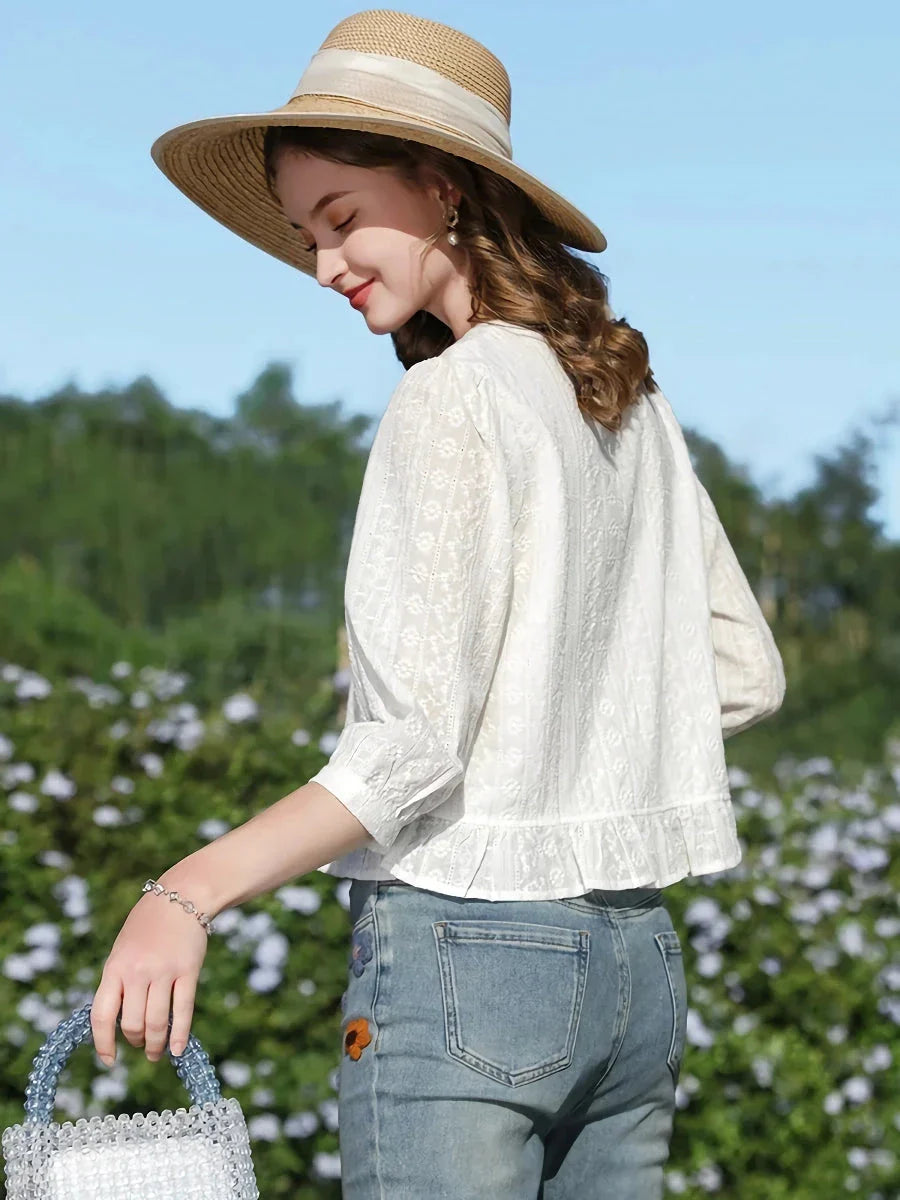 Elegant British-inspired white cotton puff sleeve blouse with a tailored regular fit and feminine flair