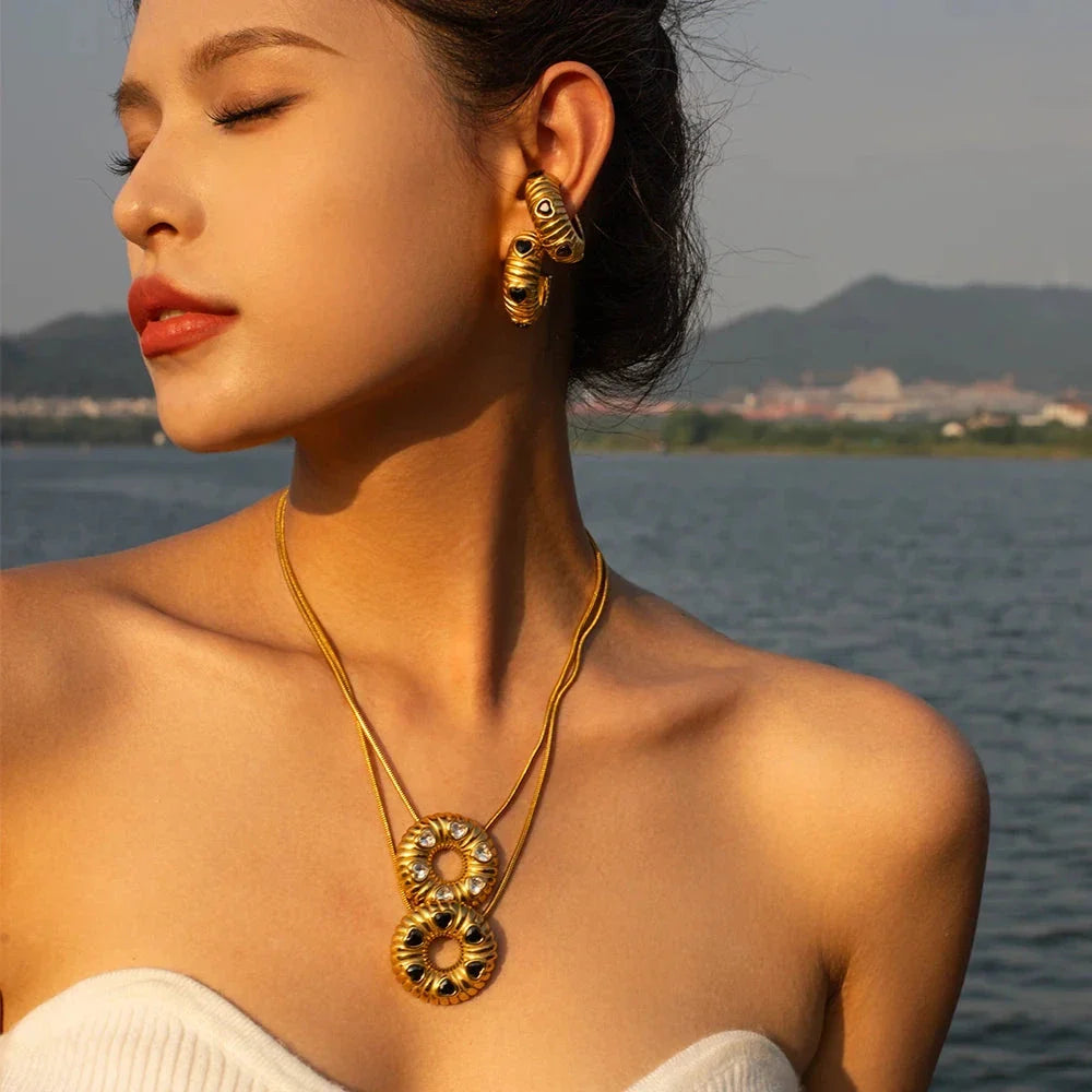 Elegant 18K gold plated minimalist jewellery set with O-shaped earrings and necklace, crafted from durable stainless steel for timeless style.