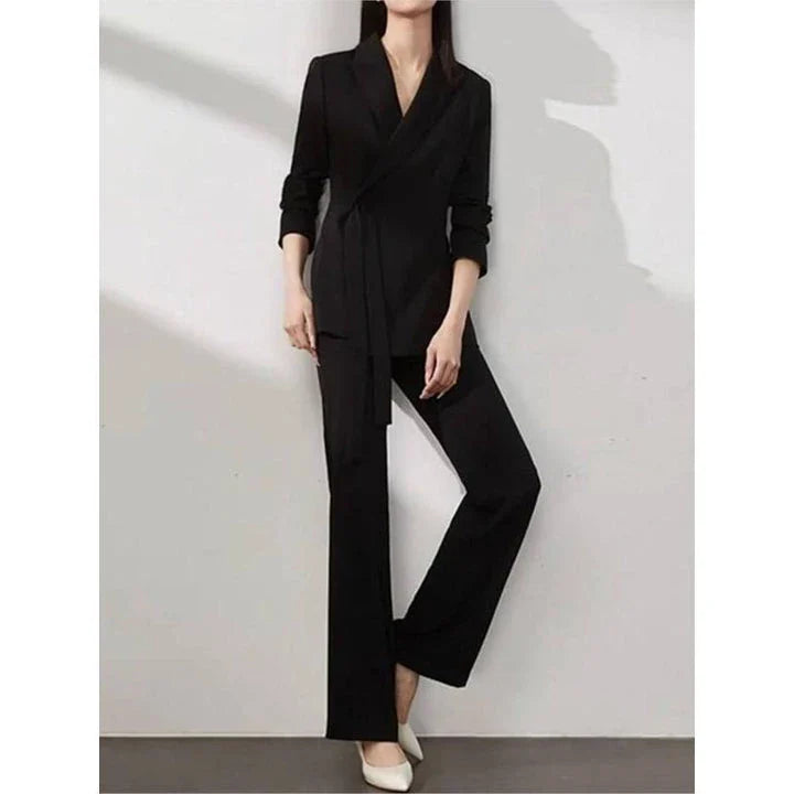 Elegant vintage-inspired two-piece office suit with tailored blazer and high-waisted trousers in premium polyester fabric