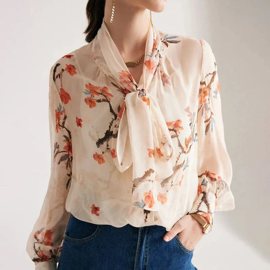 Elegant floral pattern silk and viscose blend blouse with bow collar and puff sleeves