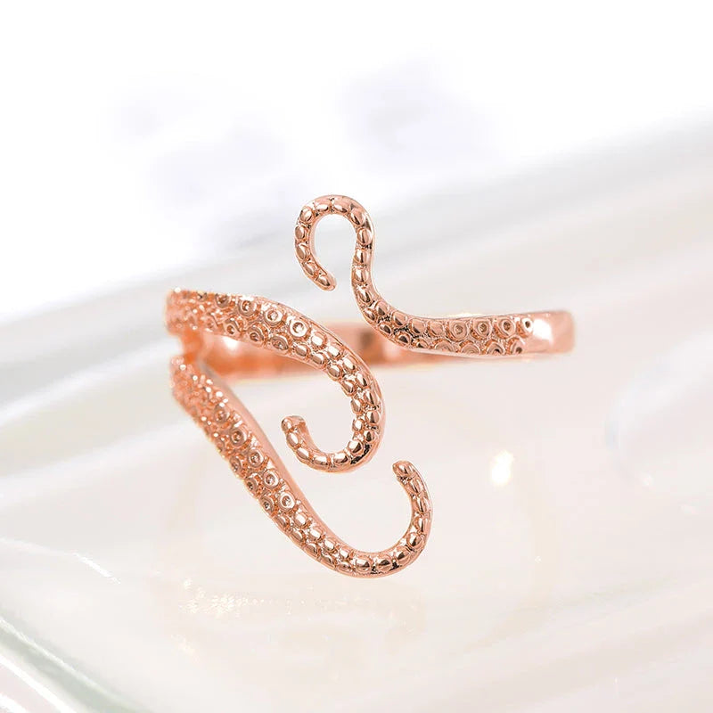 Elegant adjustable wrap ring with a detailed octopus tentacle design, made from durable stainless steel.