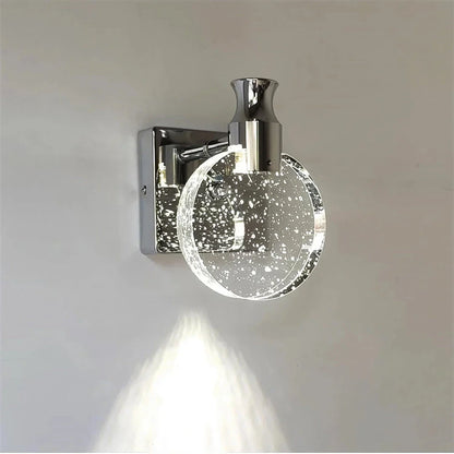 Elegant crystal LED wall lamp with copper body and glass shade, offering warm, cool, and neutral lighting modes for versatile home decor
