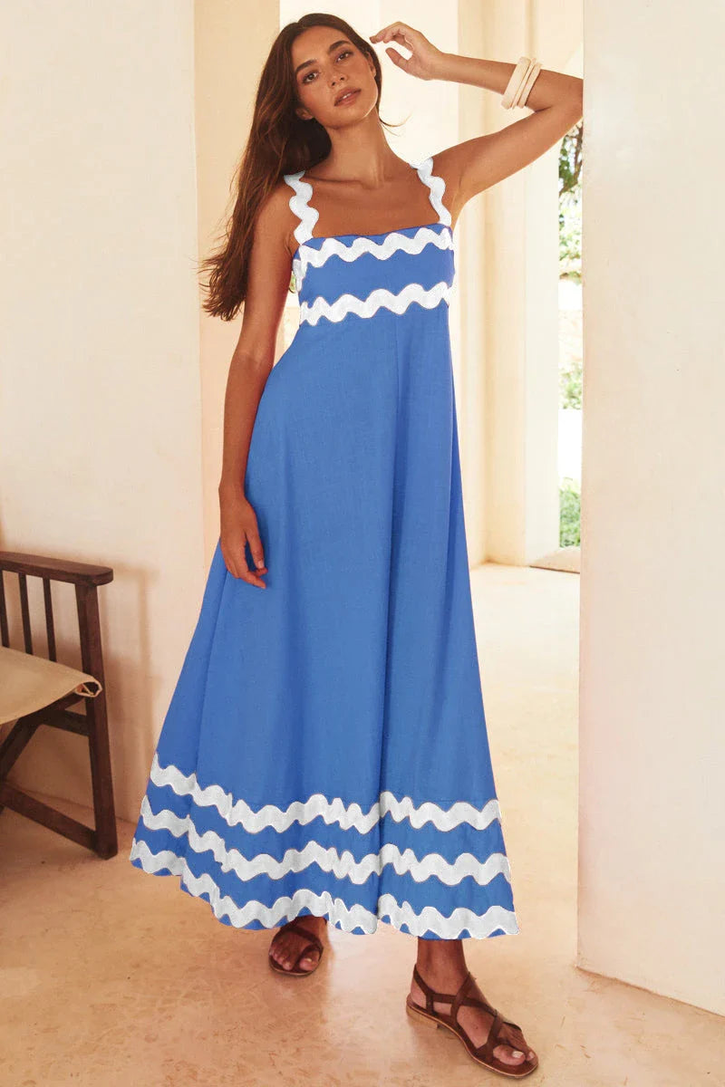 Elegant floral print suspender midi dress in black, perfect for summer beach holidays in the UK