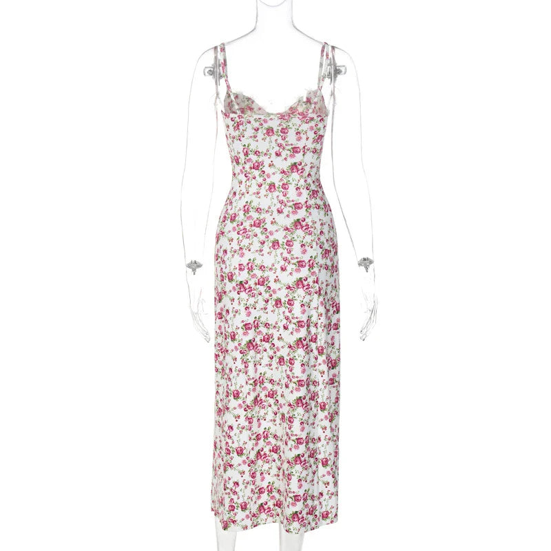 Elegant floral midi dress with slit, adjustable suspender straps, and luxurious polyester fabric for a sophisticated summer look.