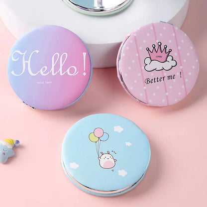 Compact portable foldable makeup mirror with cute cartoon prints for on-the-go beauty touch-ups