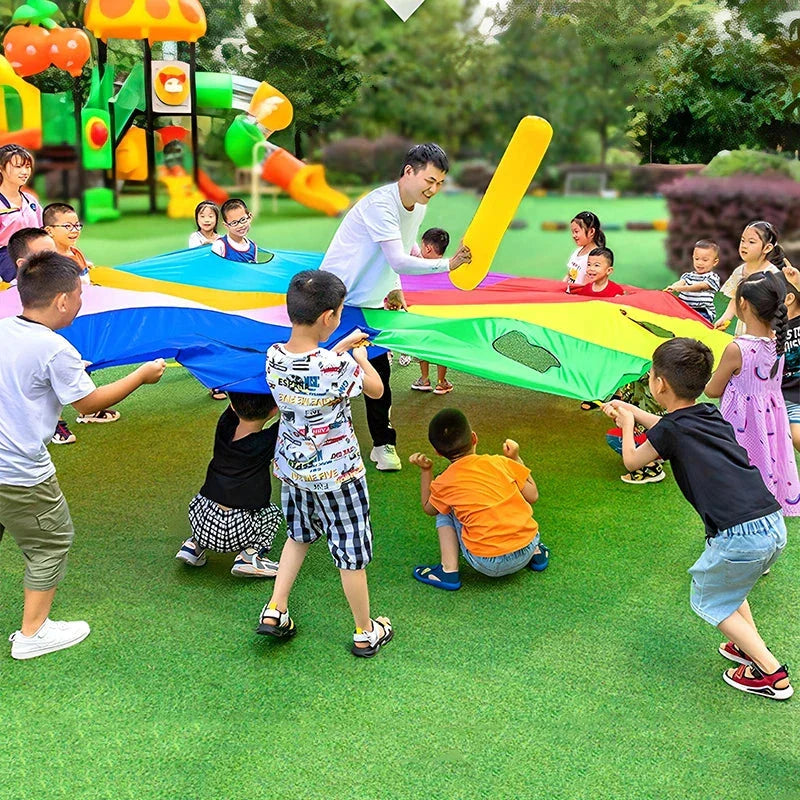 Vibrant rainbow-coloured parachute game for group play, promoting teamwork and skill development