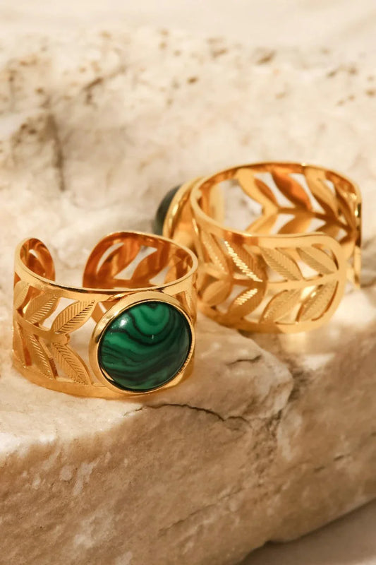 Elegant 18K gold-plated malachite leaf ring in a flat lay, studio style photograph