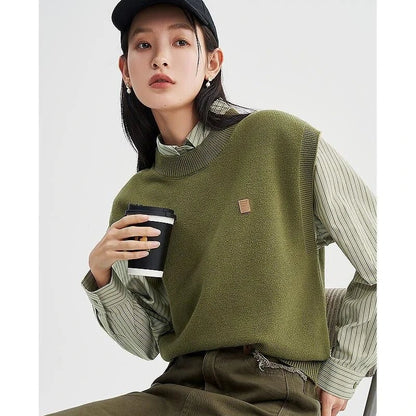 A cozy and chic knitted sleeveless vest in various colours, featuring a straight silhouette and a blend of premium materials for warmth and comfort.