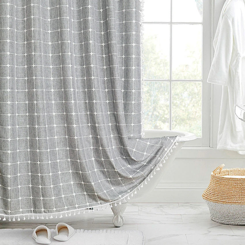 Elegant jacquard linen shower curtain with a geometric pattern and charming tassel accents, available in multiple sizes and colours for a premium bathroom upgrade.