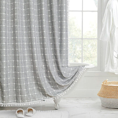Elegant jacquard linen shower curtain with a geometric pattern and charming tassel accents, available in multiple sizes and colours for a premium bathroom upgrade.