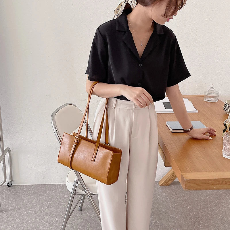 A premium polyester tote bag in a variety of colours, featuring a stylish Japanese and Korean-inspired design for the modern British shopper.