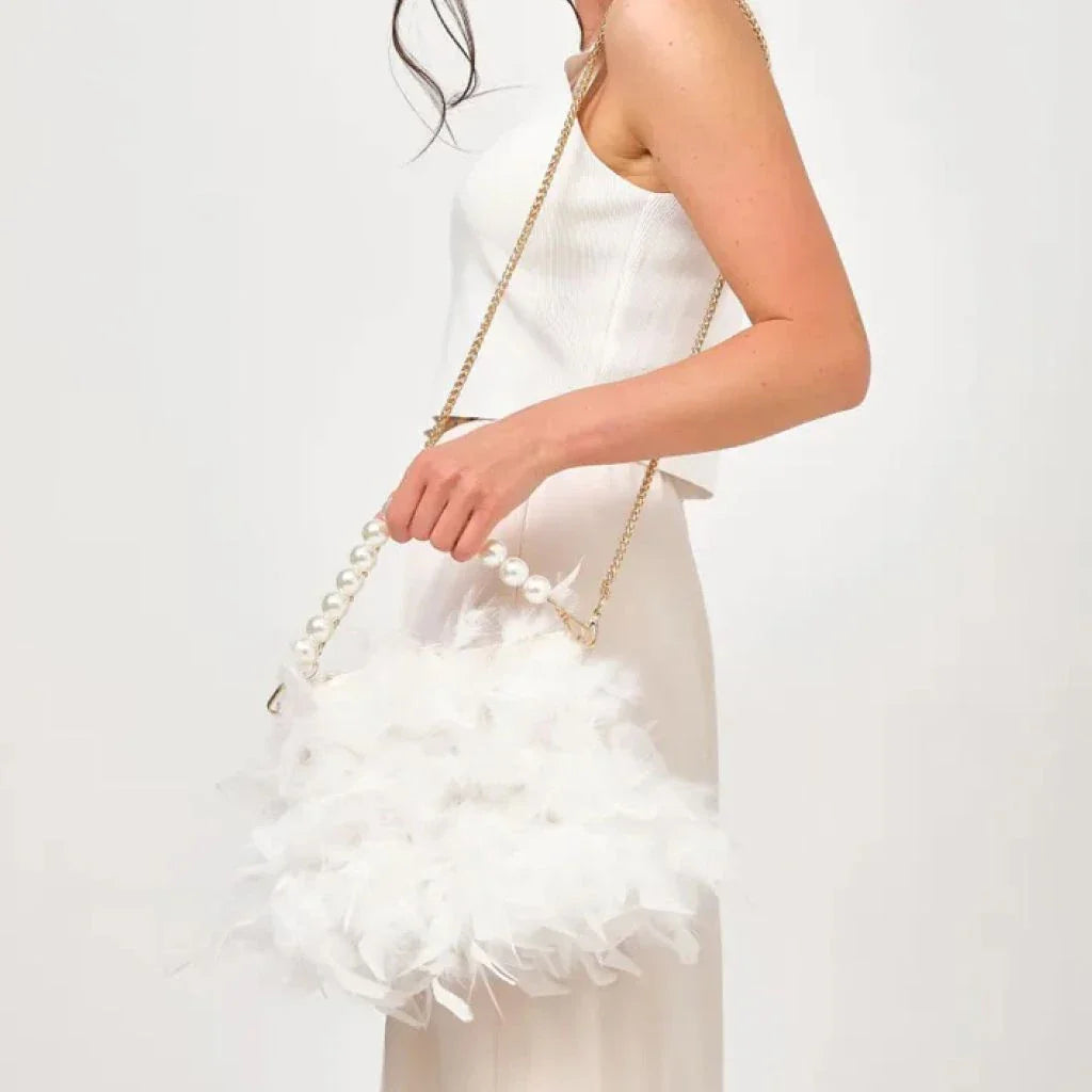 Elegant feather clutch bag with pearls and metal chains, a versatile and sophisticated evening accessory