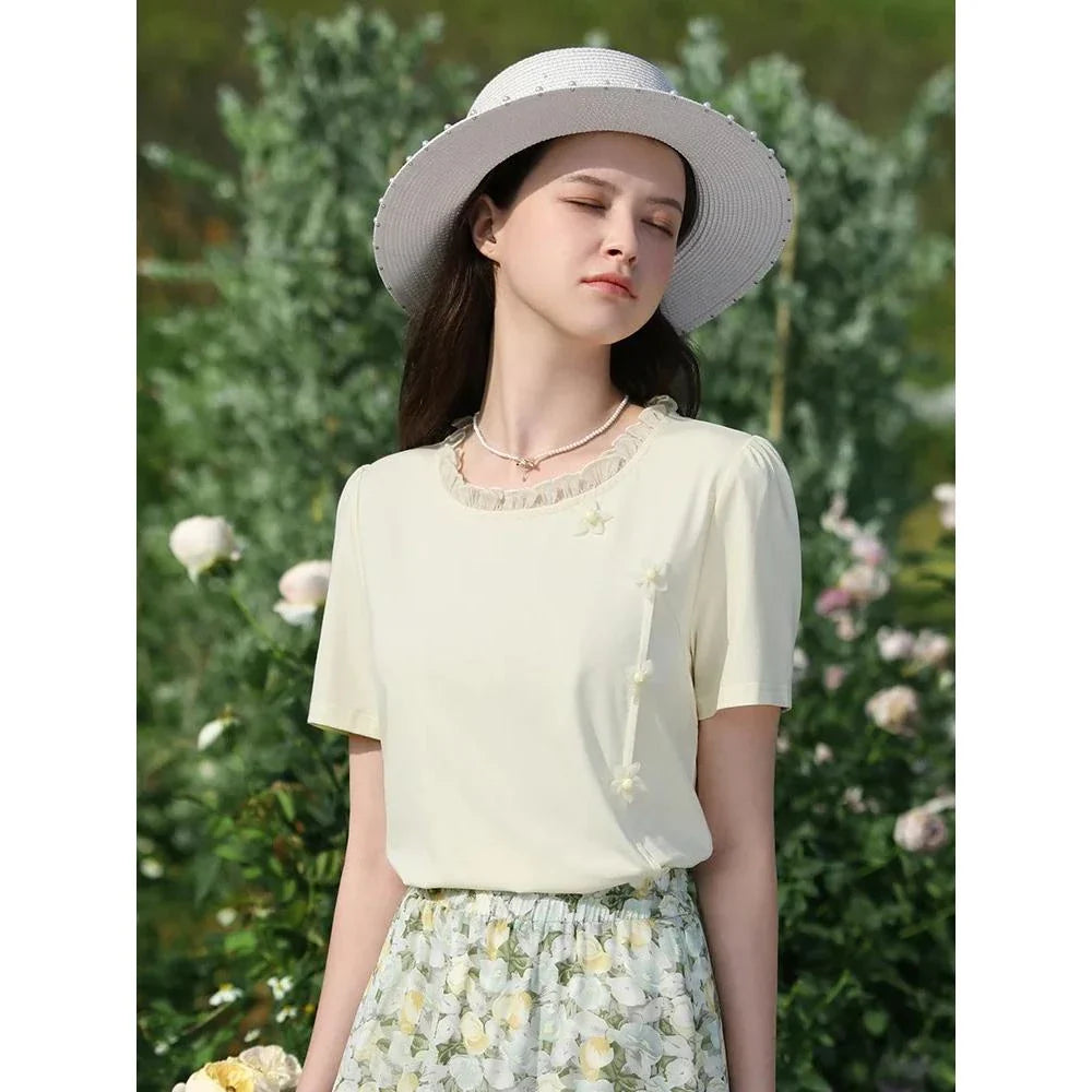 Elegant floral short sleeve t-shirt with wooden ear side detail, perfect for chic British summer style