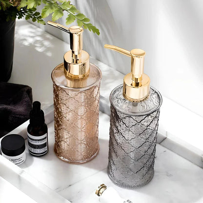 Elegant glass soap dispenser with sleek, minimalist design for bathroom and kitchen use