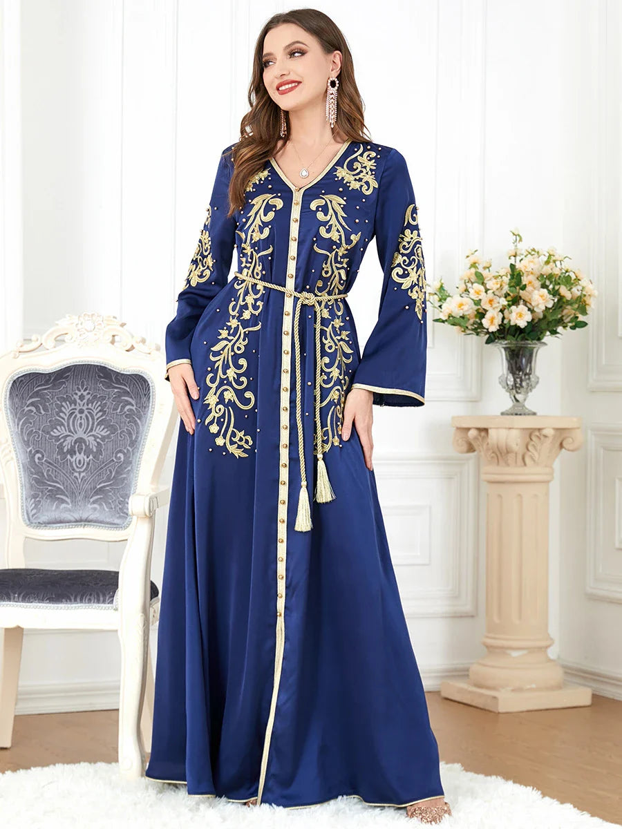 A sophisticated long-sleeve women's dress with a captivating floral embroidery pattern and a refined colour palette, suitable for a variety of occasions.