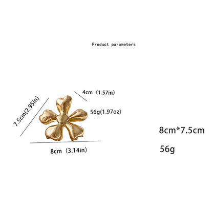 Gold floral metal hair claws - chic hair accessories for women with modern design and natural elegance