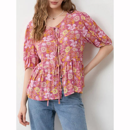 Elegant floral lace-up bow blouse with unique hollow-out details and a delicate floral print