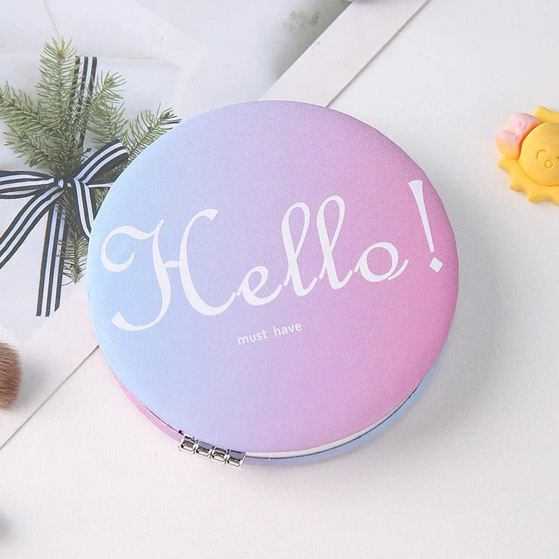 Compact portable foldable makeup mirror with cute cartoon prints for on-the-go beauty touch-ups