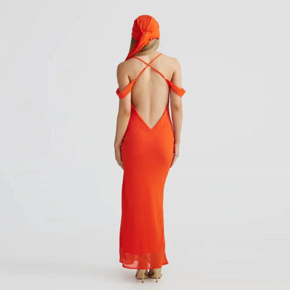 Elegant off-shoulder maxi dress in orange colour, featuring a halter backless design and pile collar neckline for a sophisticated look.