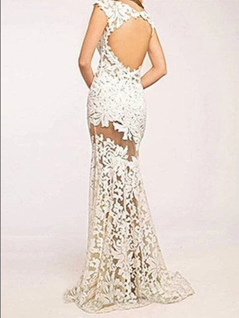 Elegant white lace cocktail dress with sleeveless design and flowing skirt