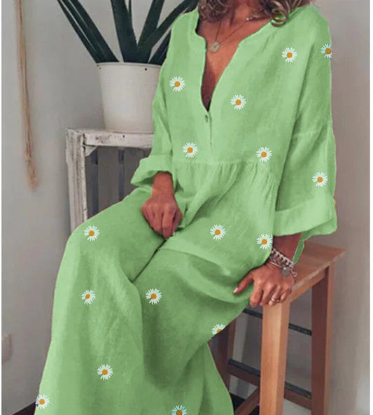 A stylish and comfortable loose dress featuring a charming daisy print and long sleeves, perfect for various occasions.