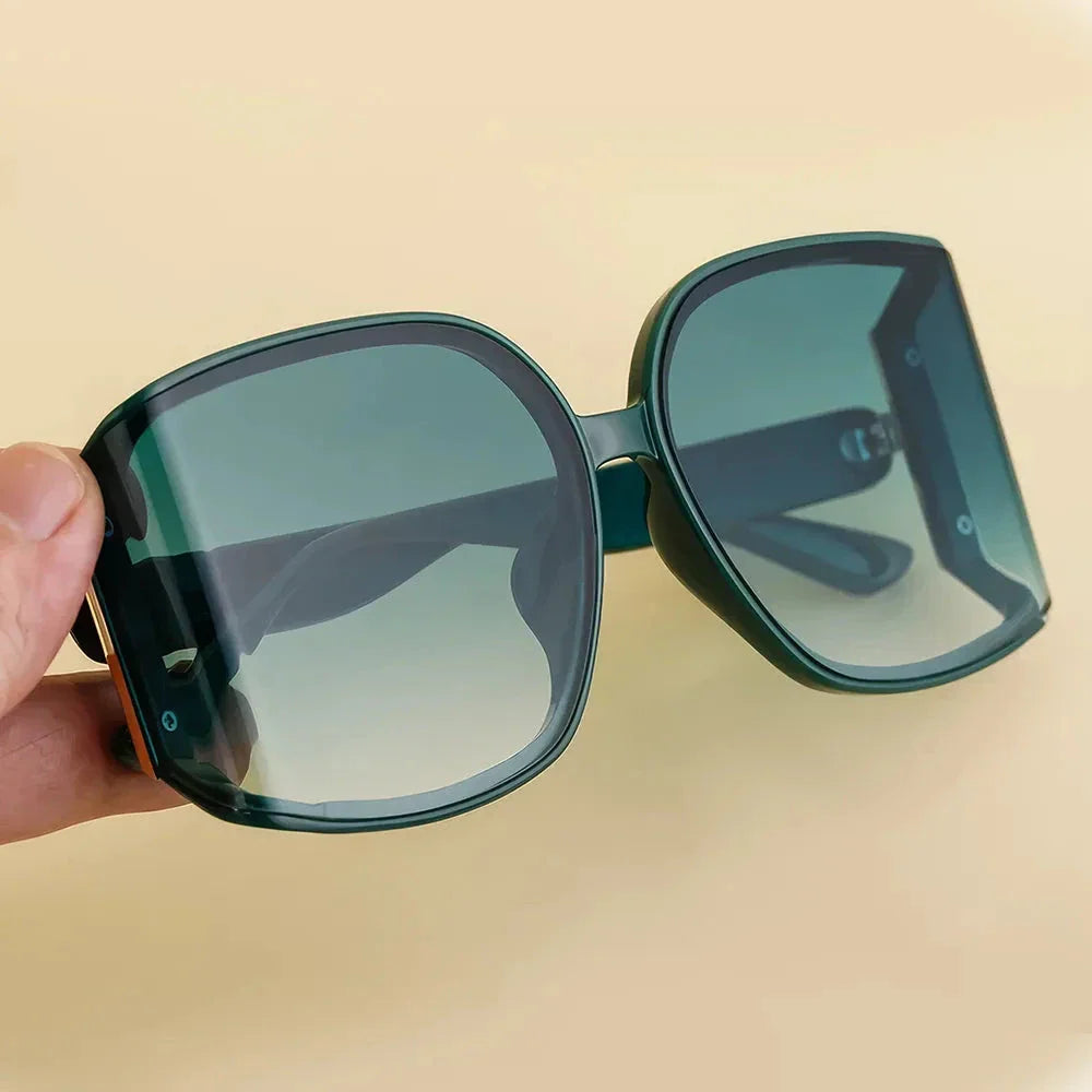 Chic and oversized square sunglasses with gradient lenses, providing UV protection and a stylish look for women