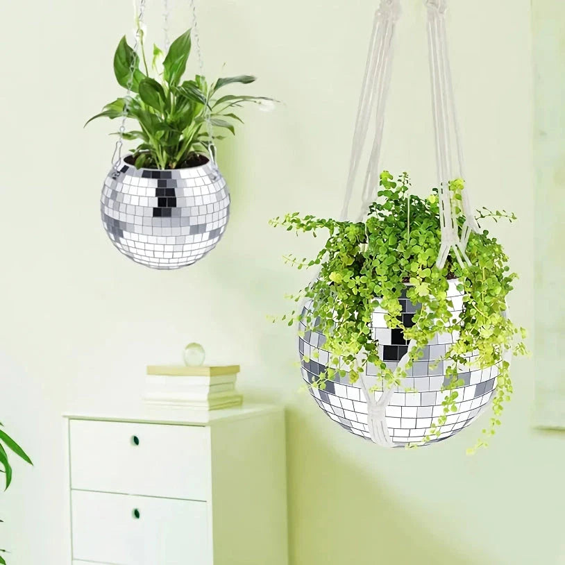 Decorative silver disco ball shaped hanging planter with reflective mirror accents for stylish indoor or outdoor decor