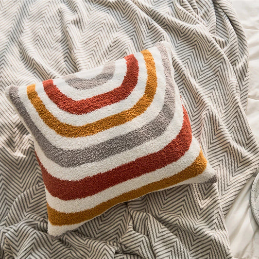 Bohemian-inspired microfibre cushion cover in light pink and white with a cosy, fuzzy texture