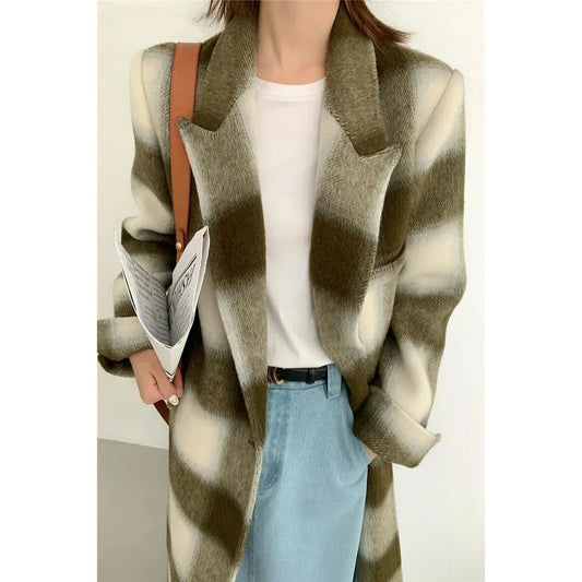 Elegant plaid double-breasted long woollen coat for women, featuring a premium blend of wool, cotton and polyester for exceptional quality and warmth.